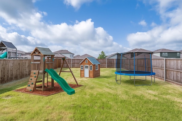 1653 Seadrift Dr, Forney, TX 75126 - fenced backyard featuring a storage unit, a trampoline, and a playground