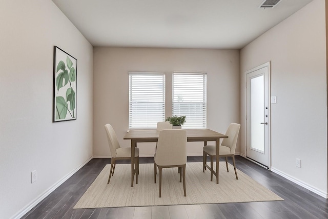 1653 Seadrift Dr, Forney, TX 75126 - dining space featuring plenty of natural light and dark wood-style flooring