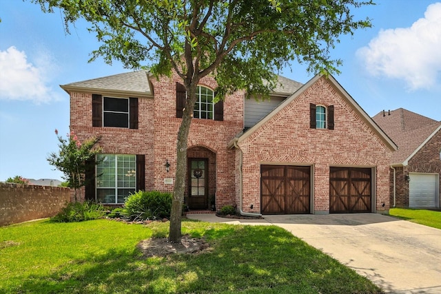 8161 Watson Rd, Lantana, TX 76226 - view of front of property featuring driveway, brick siding, and a garage