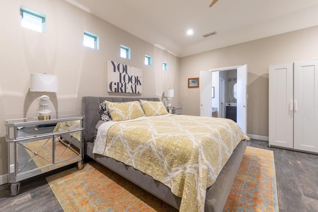 1211 Circle Ln, Bedford, TX 76022 - bedroom featuring dark wood finished floors and ensuite bath