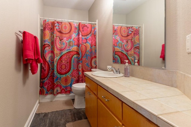 1211 Circle Ln, Bedford, TX 76022 - bathroom featuring wood finished floors, vanity, and a shower with curtain