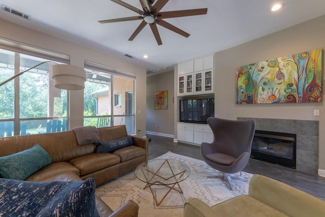1211 Circle Ln, Bedford, TX 76022 - living room with ceiling fan, recessed lighting, dark wood-style floors, and a tiled fireplace