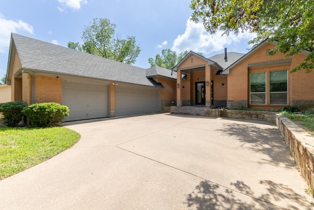 1211 Circle Ln, Bedford, TX 76022 - view of front of property with roof with shingles, brick siding, driveway, and stone siding