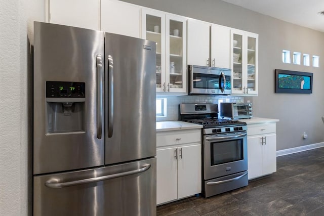 1211 Circle Ln, Bedford, TX 76022 - kitchen with appliances with stainless steel finishes, light countertops, and white cabinets