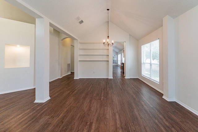 6736 Braeview Dr, Fort Worth, TX 76137 - unfurnished living room featuring a chandelier, arched walkways, dark wood-style floors, vaulted ceiling, and built in shelves