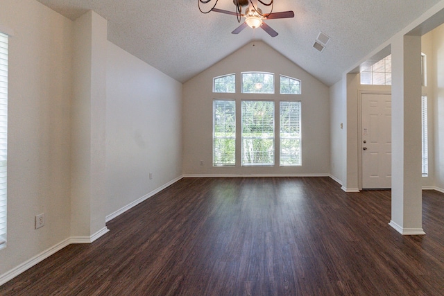 6736 Braeview Dr, Fort Worth, TX 76137 - unfurnished living room featuring a ceiling fan, dark wood-style flooring, a textured ceiling, and vaulted ceiling