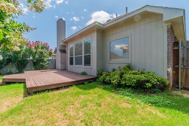 6736 Braeview Dr, Fort Worth, TX 76137 - back of property featuring a fenced backyard, a wooden deck, and a chimney