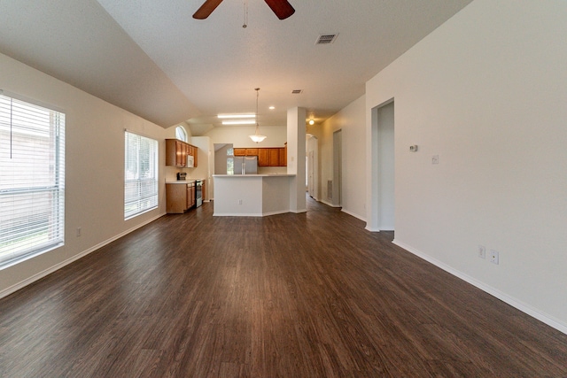6736 Braeview Dr, Fort Worth, TX 76137 - unfurnished living room with dark wood-type flooring, a ceiling fan, and lofted ceiling