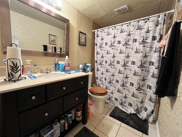 18333 Roehampton Dr Unit 513, Dallas, TX 75252 - full bath featuring a textured wall, tile patterned flooring, vanity, and a shower with curtain