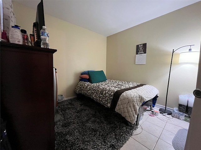 18333 Roehampton Dr Unit 513, Dallas, TX 75252 - bedroom featuring baseboards and light tile patterned floors