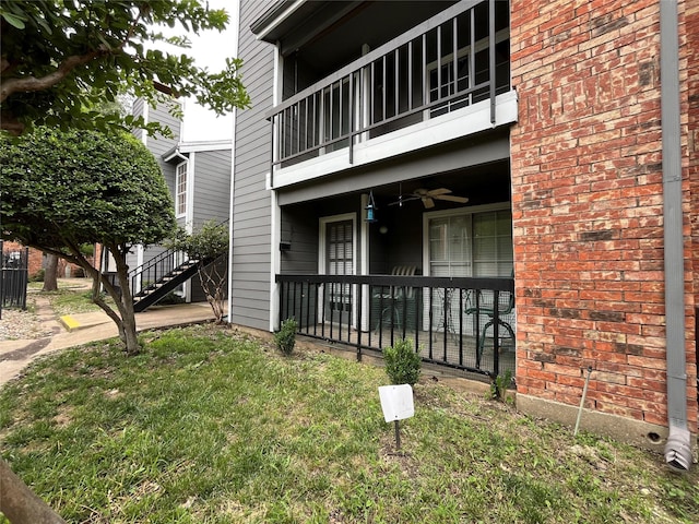 18333 Roehampton Dr Unit 513, Dallas, TX 75252 - view of side of property featuring a balcony, ceiling fan, and brick siding