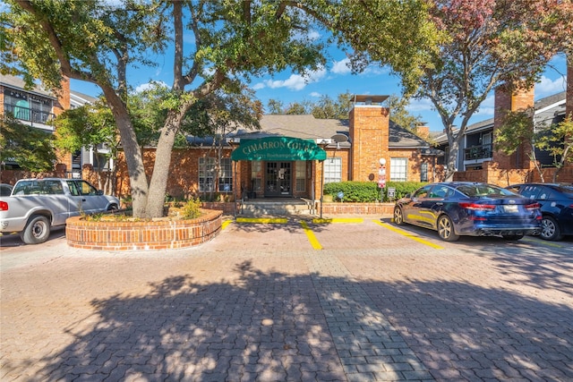 18333 Roehampton Dr Unit 513, Dallas, TX 75252 - view of property featuring uncovered parking