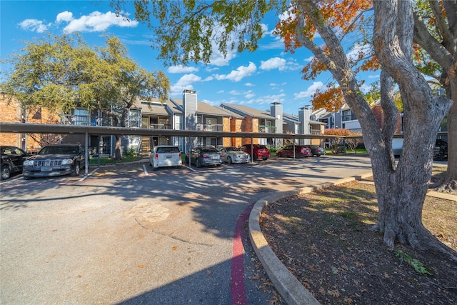 18333 Roehampton Dr Unit 513, Dallas, TX 75252 - view of front of house with a residential view and covered parking