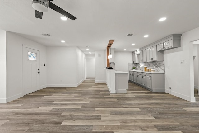 4807 Bedford Dr, Mesquite, TX 75150 - kitchen with gray cabinetry, a ceiling fan, recessed lighting, light countertops, and light wood-type flooring
