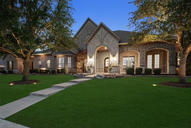 1861 Sand Creek Dr, Prosper, TX 75078 - french country inspired facade featuring a front yard and brick siding