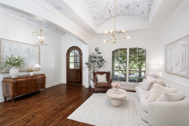 1861 Sand Creek Dr, Prosper, TX 75078 - living room featuring a chandelier, arched walkways, vaulted ceiling, hardwood / wood-style floors, and crown molding