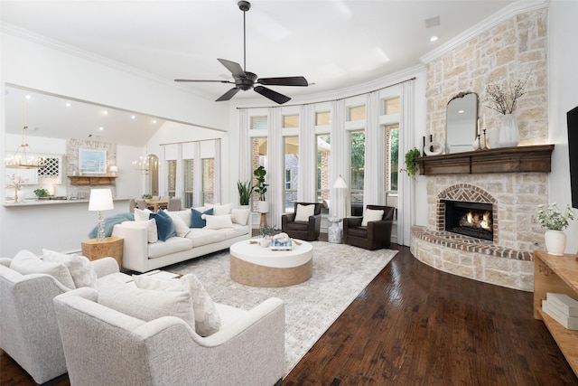 1861 Sand Creek Dr, Prosper, TX 75078 - living room with ornamental molding, dark wood-style floors, a stone fireplace, ceiling fan, and recessed lighting
