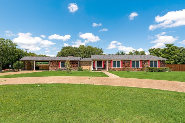 1102 Griffith Ave, Terrell, TX 75160 - ranch-style house featuring brick siding, a carport, and driveway