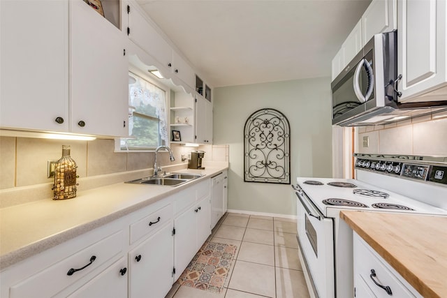 1102 Griffith Ave, Terrell, TX 75160 - kitchen with white appliances, white cabinetry, backsplash, open shelves, and light tile patterned floors