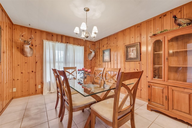 1102 Griffith Ave, Terrell, TX 75160 - dining space featuring a chandelier, wood walls, and light tile patterned floors