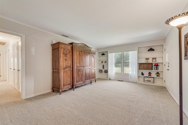 1102 Griffith Ave, Terrell, TX 75160 - living room with light colored carpet, ornamental molding, and built in features