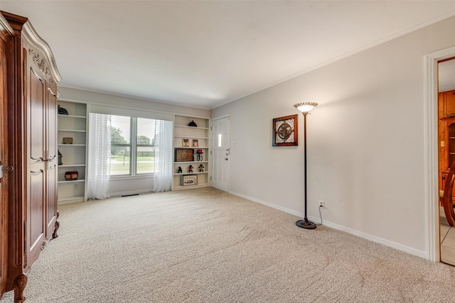 1102 Griffith Ave, Terrell, TX 75160 - empty room featuring light colored carpet and built in features