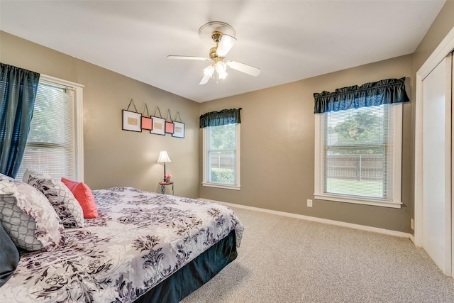 1102 Griffith Ave, Terrell, TX 75160 - bedroom featuring carpet flooring, multiple windows, and a ceiling fan