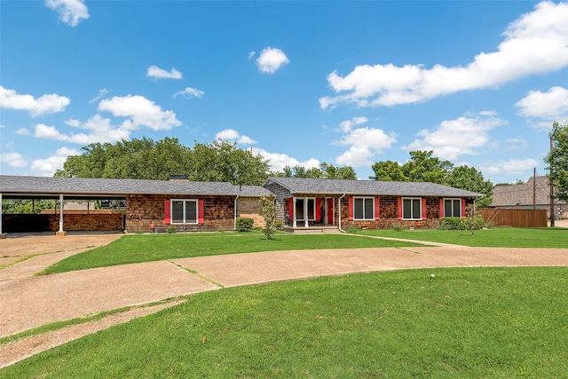 1102 Griffith Ave, Terrell, TX 75160 - ranch-style house featuring brick siding, an attached carport, and concrete driveway