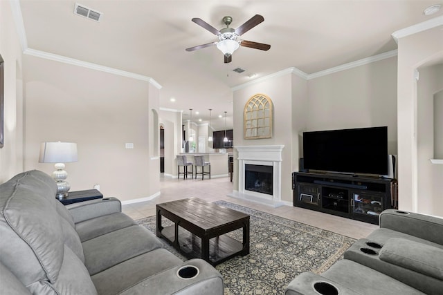 11513 Champion Creek Dr, Frisco, TX 75036 - living room featuring a ceiling fan, ornamental molding, light tile patterned floors, and a fireplace with raised hearth