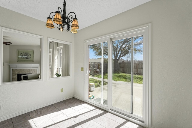 1512 La Paz Dr, Plano, TX 75074 - unfurnished dining area featuring a chandelier, a fireplace, and a textured ceiling