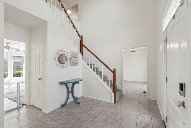 1512 La Paz Dr, Plano, TX 75074 - foyer entrance with stairway, a high ceiling, light marble finish flooring, and a ceiling fan