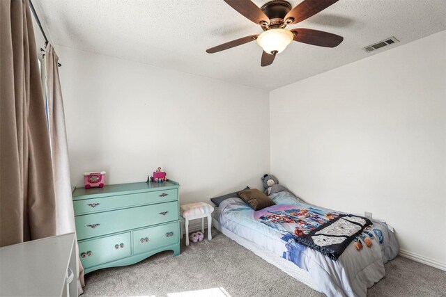 1512 La Paz Dr, Plano, TX 75074 - bedroom with light carpet, a ceiling fan, and a textured ceiling