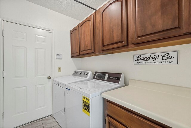 1512 La Paz Dr, Plano, TX 75074 - laundry room featuring cabinet space, separate washer and dryer, and light tile patterned floors