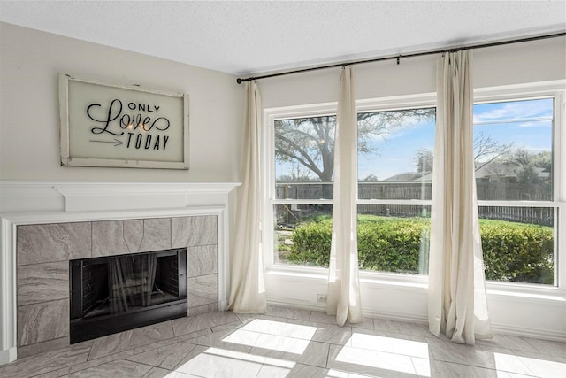 1512 La Paz Dr, Plano, TX 75074 - detailed view of a tiled fireplace and a textured ceiling