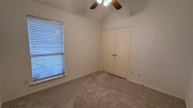 2217 Lone Pecan Dr, Garland, TX 75040 - unfurnished bedroom featuring vaulted ceiling, carpet, a closet, and ceiling fan