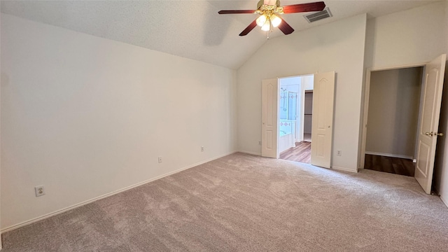 2217 Lone Pecan Dr, Garland, TX 75040 - unfurnished bedroom with light colored carpet, ceiling fan, and high vaulted ceiling