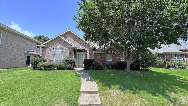 2217 Lone Pecan Dr, Garland, TX 75040 - view of front of home featuring brick siding and a front lawn