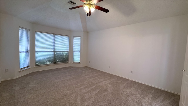 2217 Lone Pecan Dr, Garland, TX 75040 - spare room featuring carpet flooring, ceiling fan, and lofted ceiling