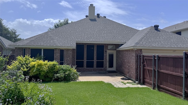 2217 Lone Pecan Dr, Garland, TX 75040 - rear view of house featuring brick siding, roof with shingles, a patio, and a gate