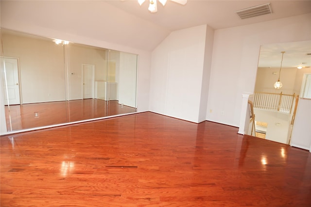 2325 Denham Dr, Arlington, TX 76001 - spare room with a ceiling fan, wood finished floors, and lofted ceiling
