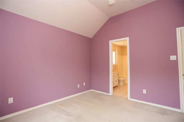 2325 Denham Dr, Arlington, TX 76001 - unfurnished bedroom with lofted ceiling, light carpet, connected bathroom, and ceiling fan