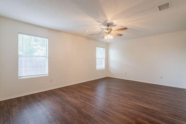 233 Stoneridge Dr, Mesquite, TX 75149 - unfurnished room with dark wood-style floors, a ceiling fan, and a textured ceiling