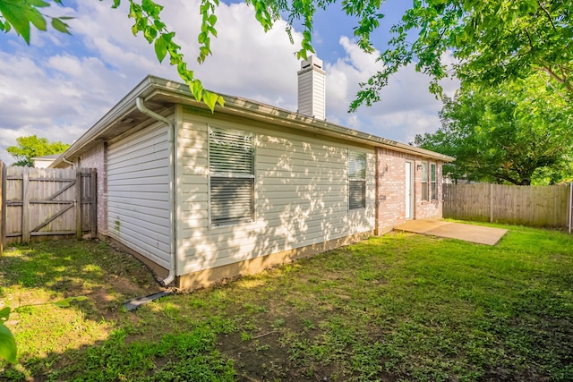 233 Stoneridge Dr, Mesquite, TX 75149 - view of property exterior featuring a fenced backyard, a chimney, a patio, and a gate