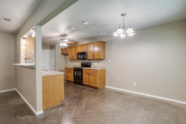 1414 Cheyenne Trl, Granbury, TX 76048 - kitchen featuring black appliances, light countertops, a ceiling fan, pendant lighting, and brown cabinets