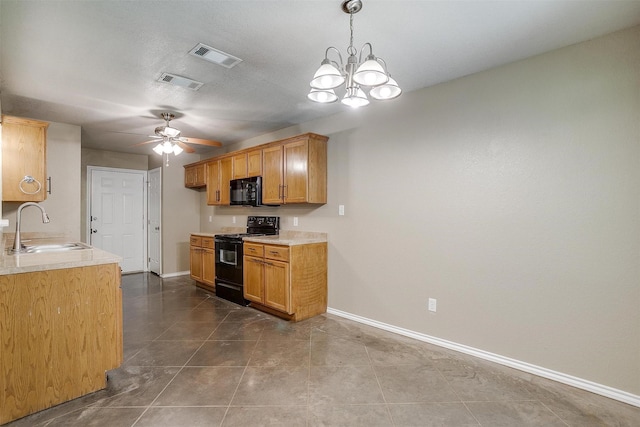 1414 Cheyenne Trl, Granbury, TX 76048 - kitchen featuring black appliances, light countertops, ceiling fan, dark tile patterned flooring, and a chandelier