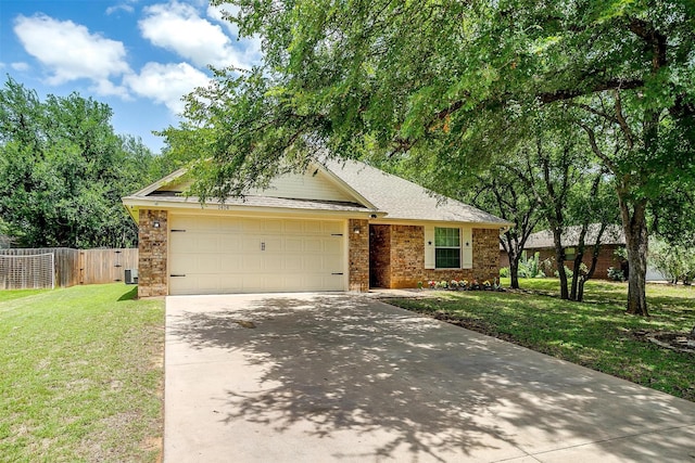 1414 Cheyenne Trl, Granbury, TX 76048 - view of front of house with driveway, a garage, and brick siding