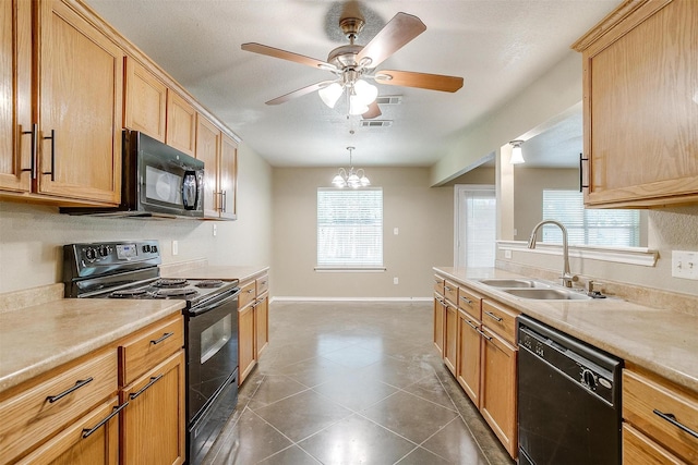 1414 Cheyenne Trl, Granbury, TX 76048 - kitchen featuring black appliances, light countertops, ceiling fan, and plenty of natural light