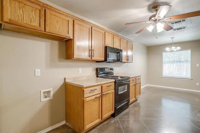 1414 Cheyenne Trl, Granbury, TX 76048 - kitchen featuring black appliances, ceiling fan, light countertops, decorative light fixtures, and a chandelier