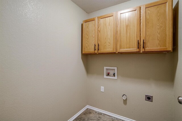 1414 Cheyenne Trl, Granbury, TX 76048 - laundry area with cabinet space, electric dryer hookup, and hookup for a washing machine