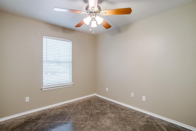 1414 Cheyenne Trl, Granbury, TX 76048 - unfurnished room featuring dark tile patterned floors and ceiling fan